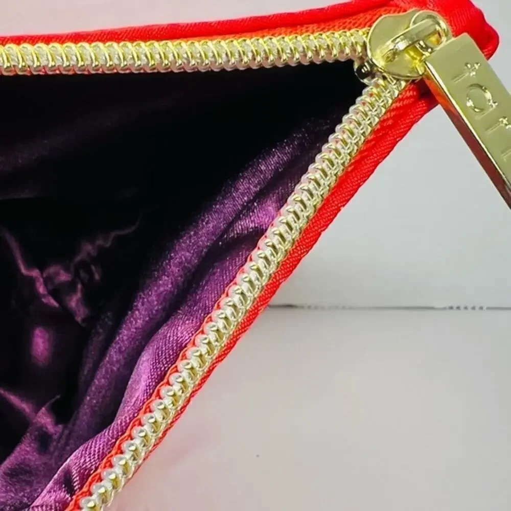 Tarte red cosmetic bag/ clutch, nice size with beautiful purple satin interior